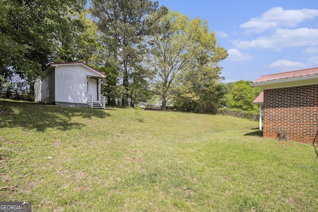 1228 Old Rockmart Rd SE, Silver Creek, GA 30173 - view of green lawn with entry steps and an outbuilding