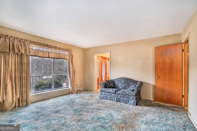 unfurnished room featuring carpet