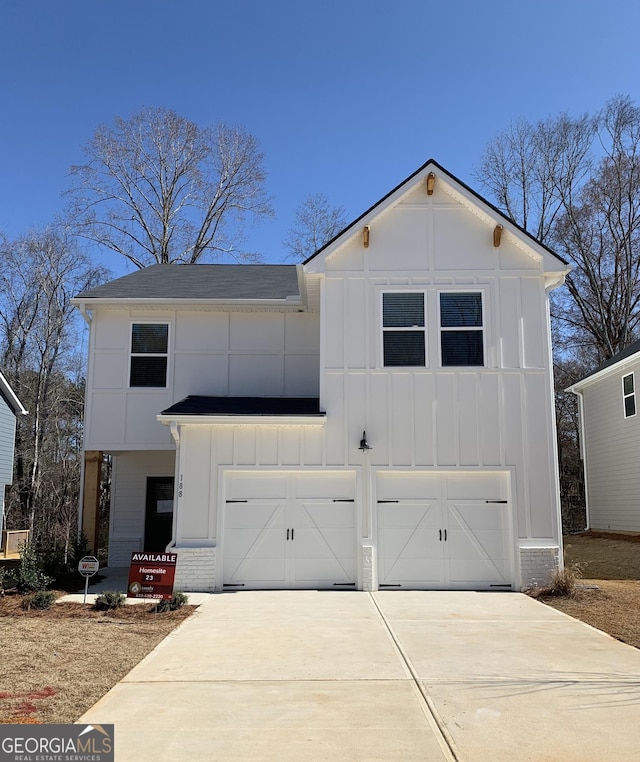 view of front of home with brick siding, roof with shingles, concrete driveway, an attached garage, and board and batten siding