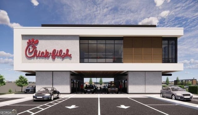 188 Weldon Rd Unit 23, Mcdonough, GA 30253 - view of building exterior with uncovered parking
