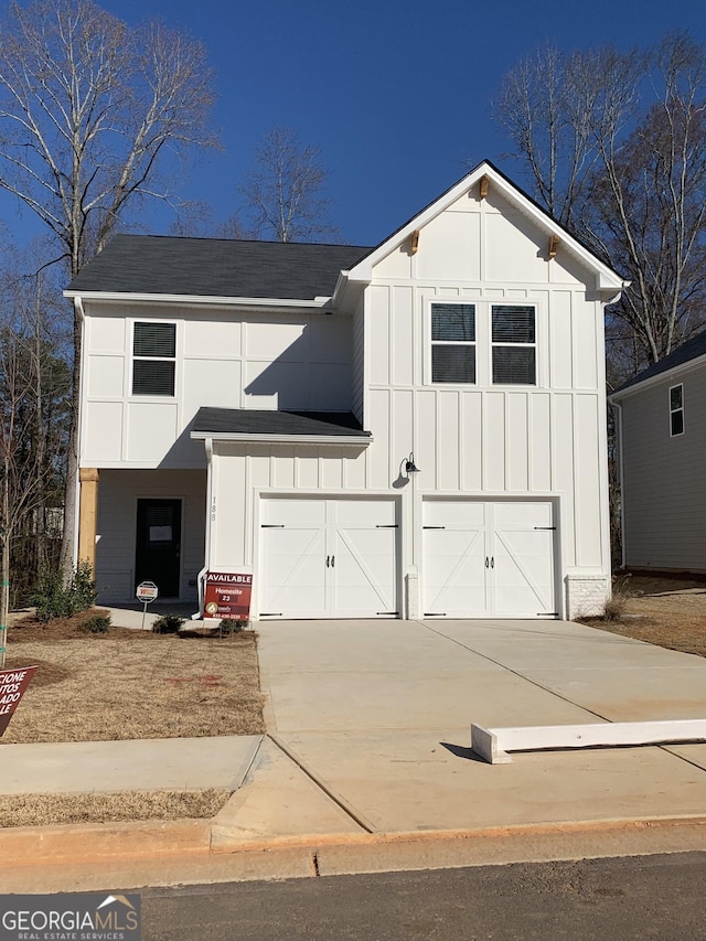 188 Weldon Rd Unit 23, Mcdonough, GA 30253 - modern farmhouse style home featuring board and batten siding, a garage, driveway, and a shingled roof