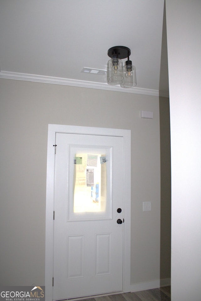 interior space with crown molding