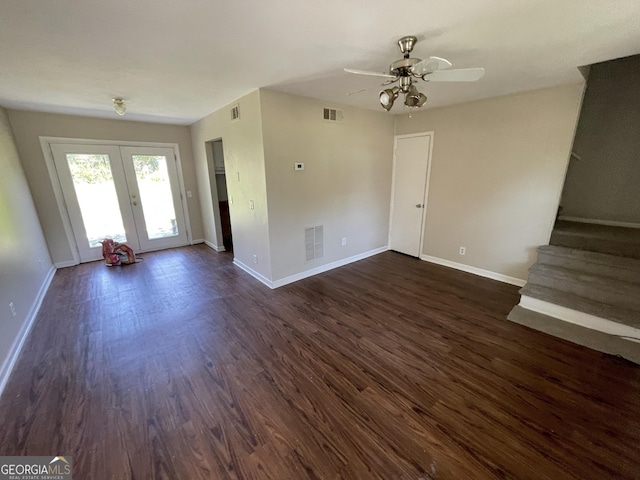 unfurnished living room featuring ceiling fan, french doors, and dark hardwood / wood-style floors