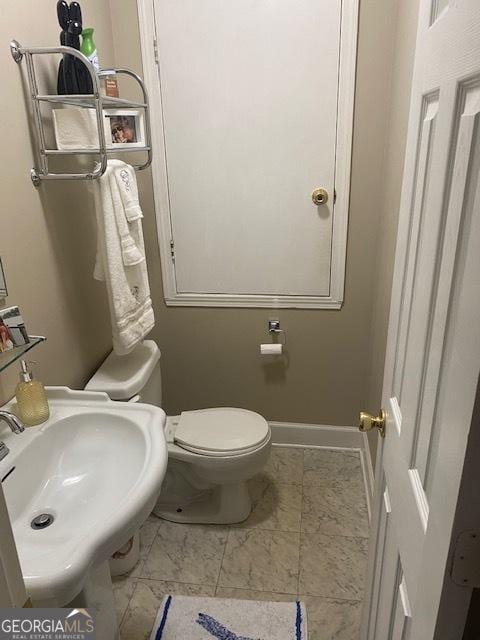 bathroom with toilet and sink