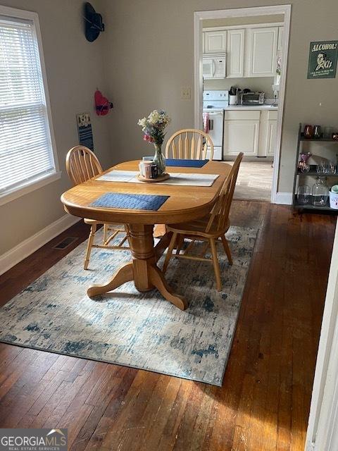 dining space featuring hardwood / wood-style floors