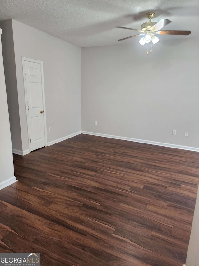 unfurnished room with ceiling fan, dark hardwood / wood-style floors, and a textured ceiling