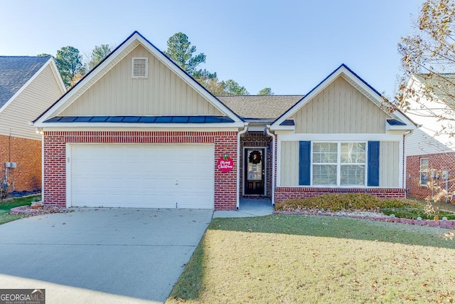 view of front of home with a front lawn and a garage