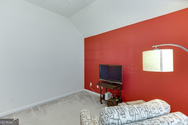 carpeted bedroom with vaulted ceiling