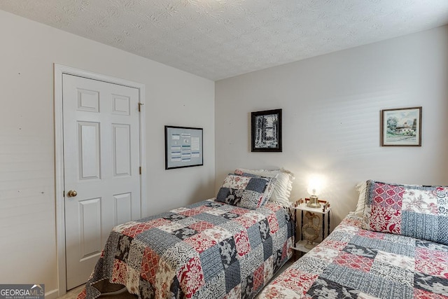 bedroom featuring a textured ceiling