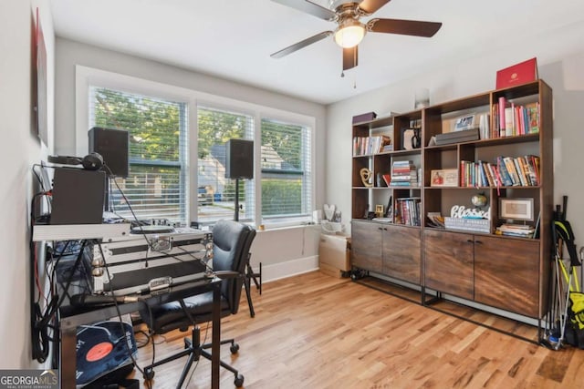 office featuring light wood-type flooring and ceiling fan