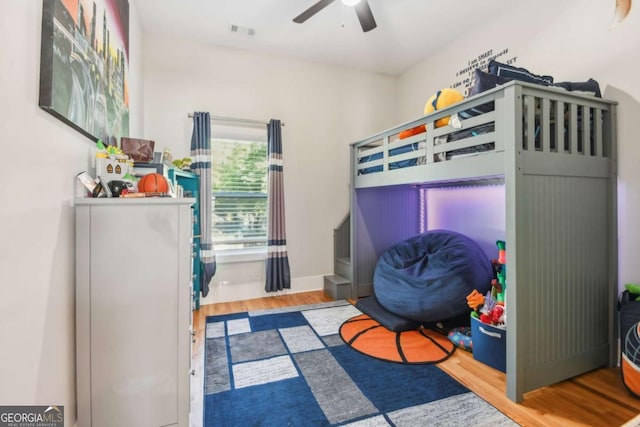 bedroom featuring wood-type flooring and ceiling fan