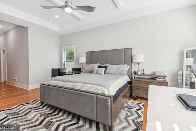 bedroom with ceiling fan and light hardwood / wood-style flooring