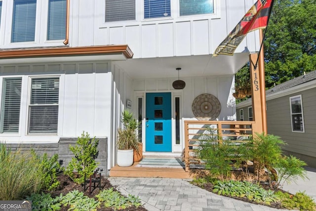 view of exterior entry with covered porch