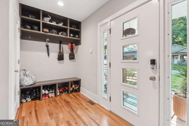 mudroom with light hardwood / wood-style flooring