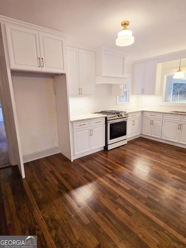 kitchen with white cabinets, dark hardwood / wood-style flooring, sink, and range with gas cooktop