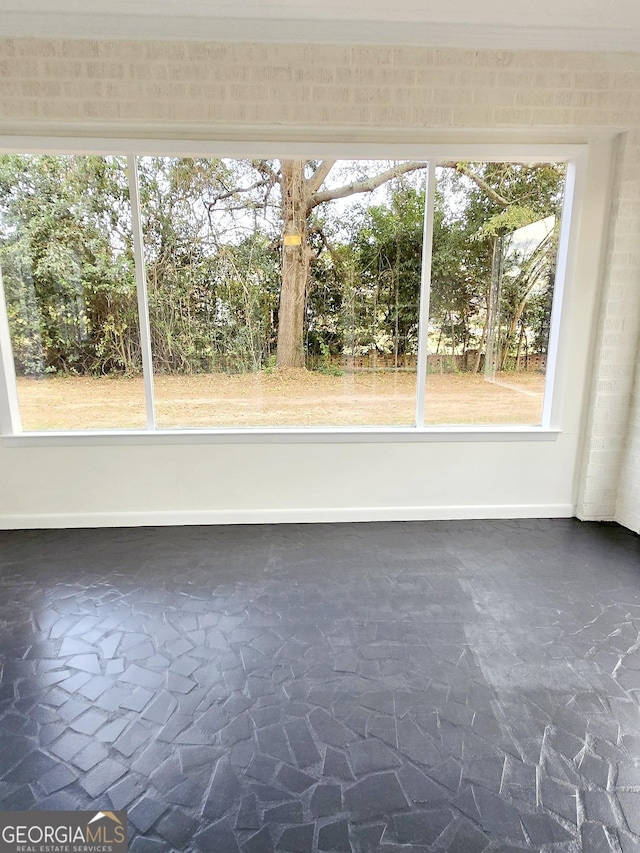 unfurnished sunroom with a healthy amount of sunlight