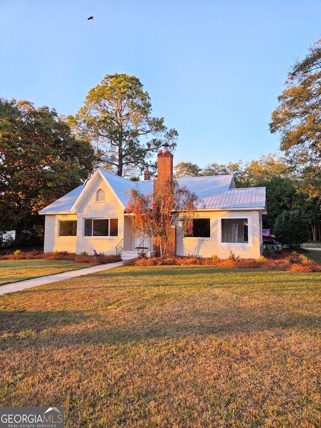 view of front of home with a front yard