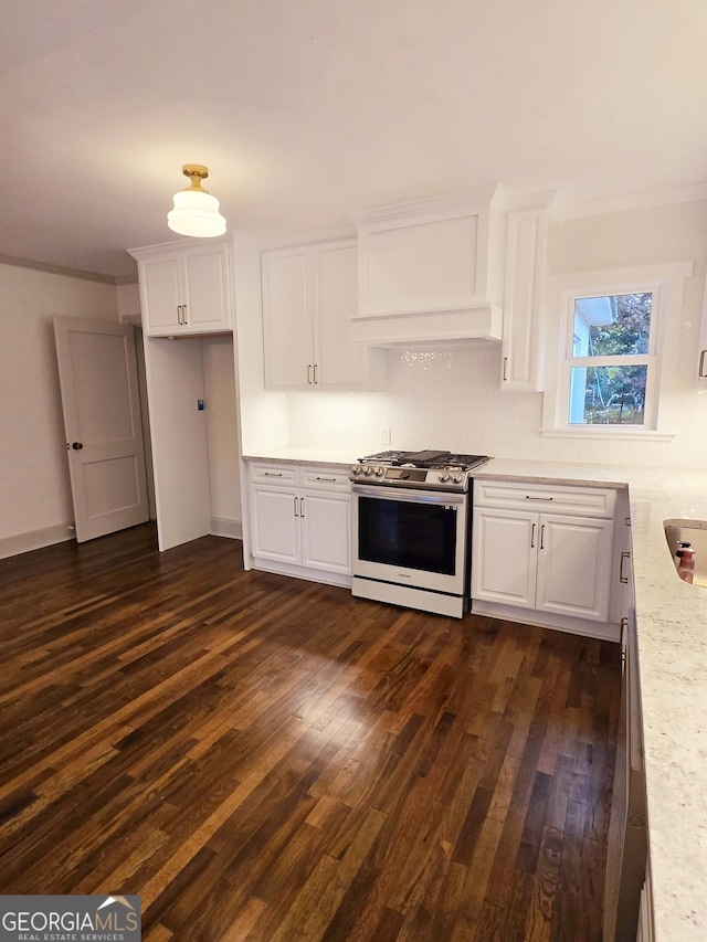 kitchen featuring light stone counters, dark hardwood / wood-style flooring, white cabinets, and stainless steel range with gas stovetop