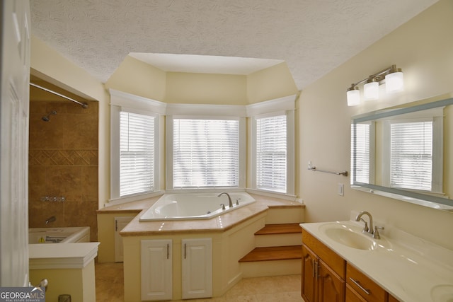full bathroom with a bath, a textured ceiling, walk in shower, and vanity