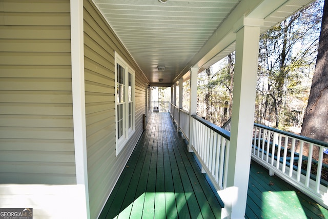 wooden terrace featuring a porch