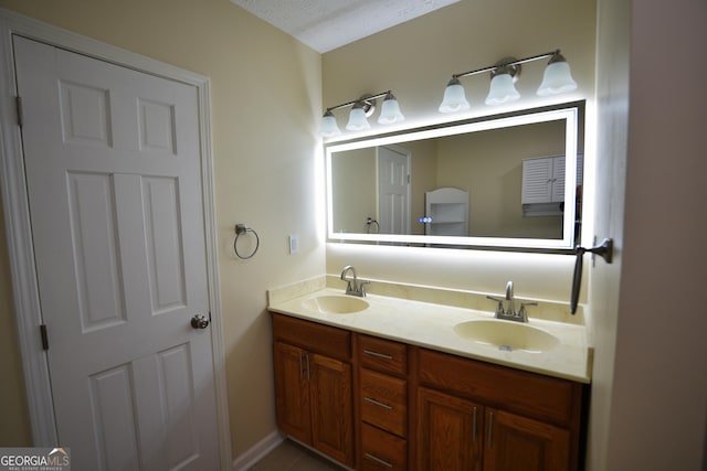 bathroom featuring double vanity and a sink