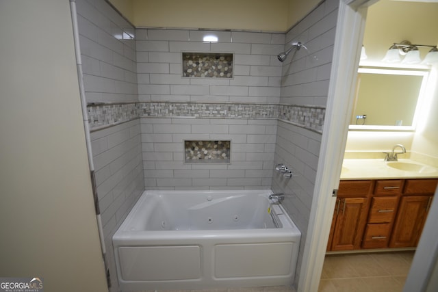 bathroom featuring a combined bath / shower with jetted tub, tile patterned flooring, and vanity