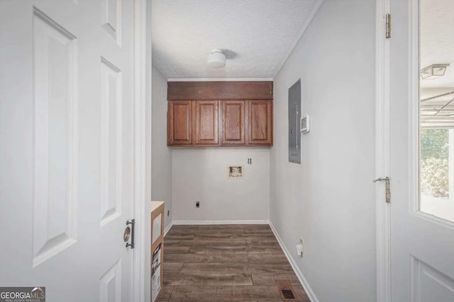 laundry room with dark wood-type flooring, cabinets, washer hookup, electric dryer hookup, and a textured ceiling