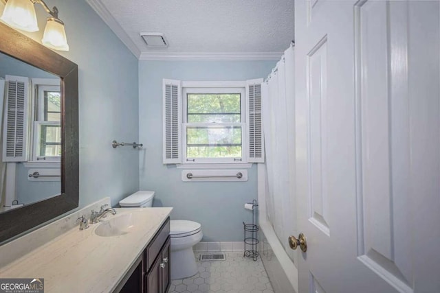 bathroom with tile patterned floors, a textured ceiling, toilet, vanity, and ornamental molding