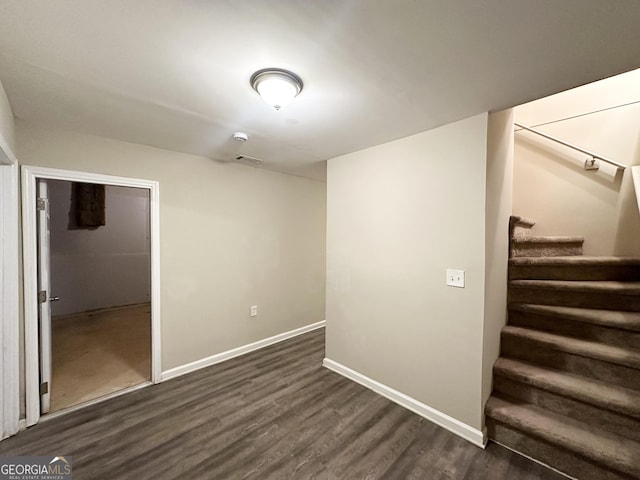 basement featuring dark hardwood / wood-style floors