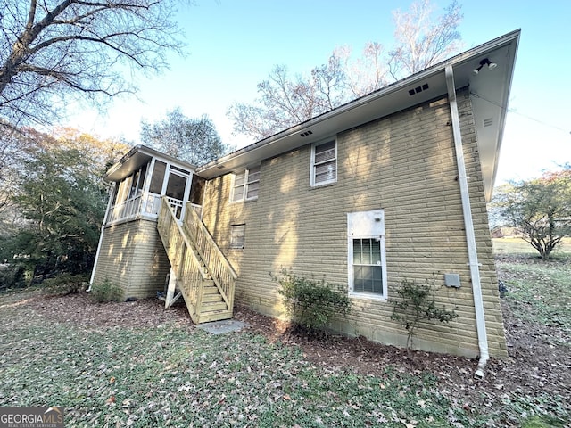 view of home's exterior featuring a sunroom