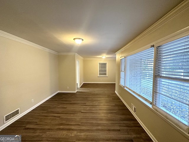 spare room with dark hardwood / wood-style floors and ornamental molding