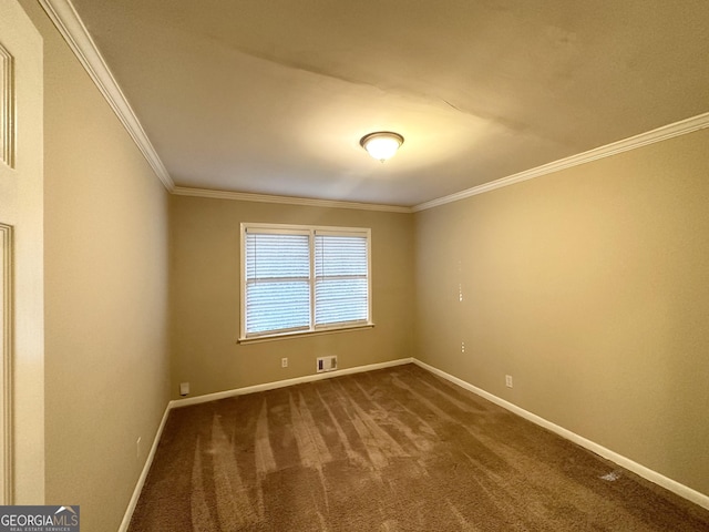 carpeted empty room featuring crown molding