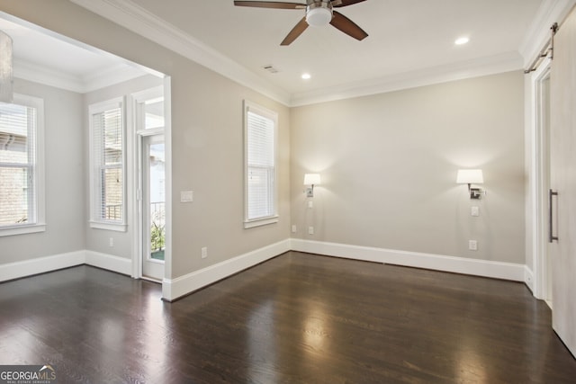 spare room with crown molding, ceiling fan, a healthy amount of sunlight, and dark hardwood / wood-style floors