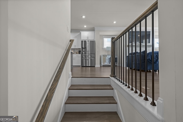 stairway with wood-type flooring