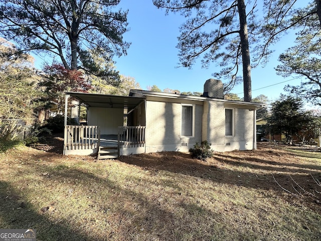 back of house with a yard