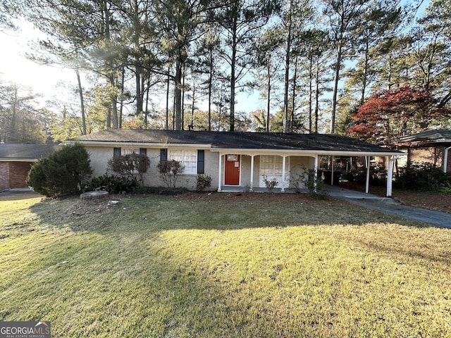 ranch-style house with a carport, covered porch, and a front yard