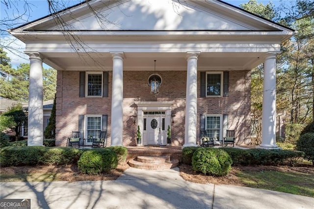 neoclassical home with a porch