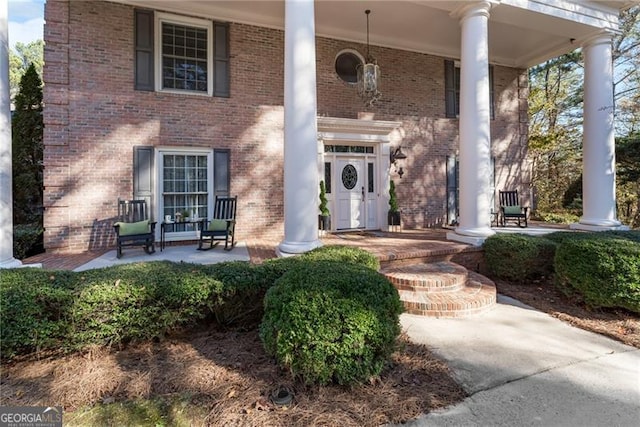 doorway to property with a porch