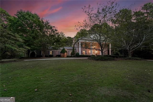 view of yard at dusk