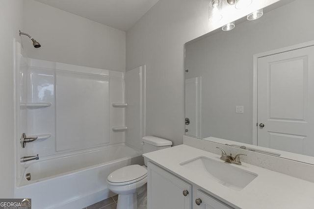 full bathroom with shower / washtub combination, vanity, tile patterned floors, and toilet