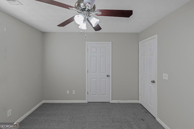 carpeted empty room with ceiling fan