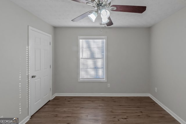 empty room featuring dark hardwood / wood-style floors