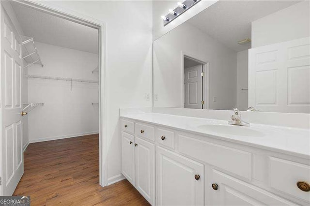 bathroom with vanity and hardwood / wood-style floors