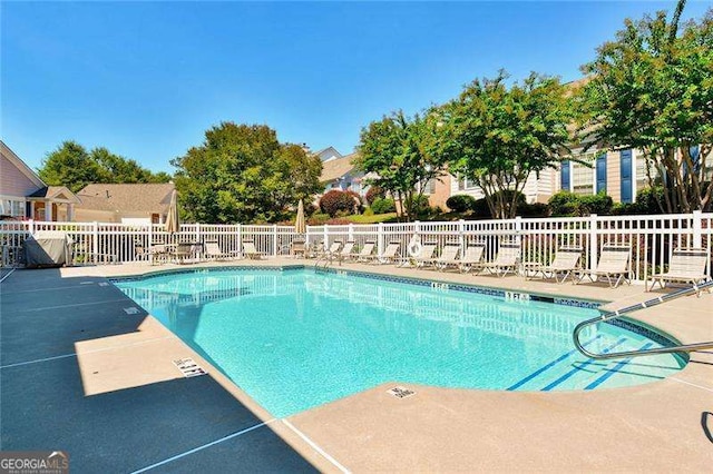 view of swimming pool featuring a patio