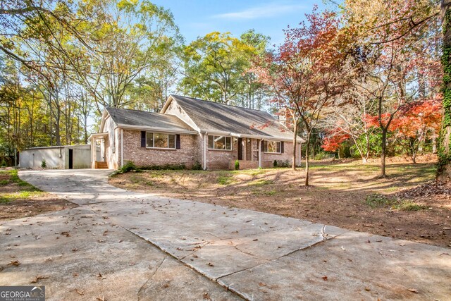 view of front of home featuring an outbuilding