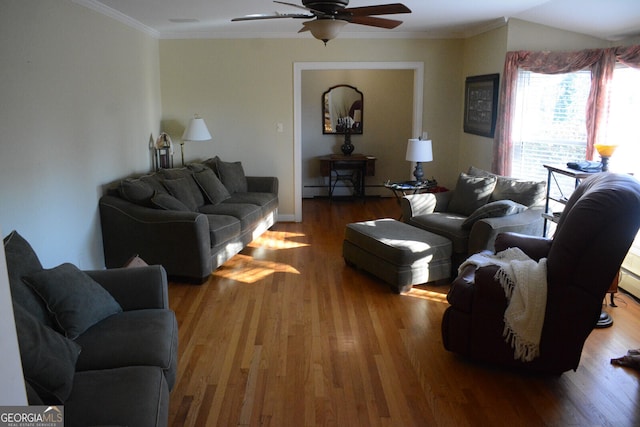 living room with ceiling fan, ornamental molding, a baseboard radiator, and hardwood / wood-style floors