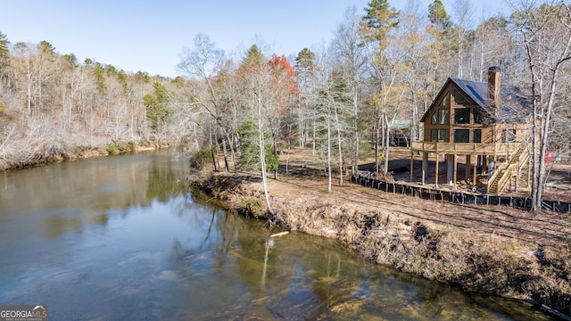 exterior space featuring a forest view