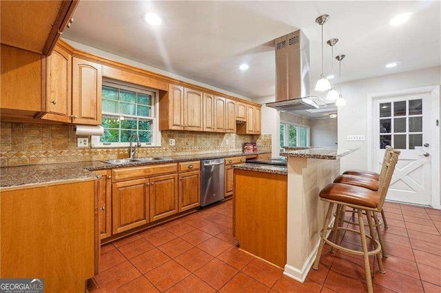 kitchen featuring stainless steel dishwasher, island range hood, sink, decorative light fixtures, and a kitchen island