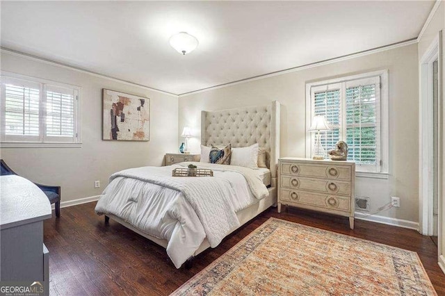 bedroom with dark hardwood / wood-style floors and ornamental molding