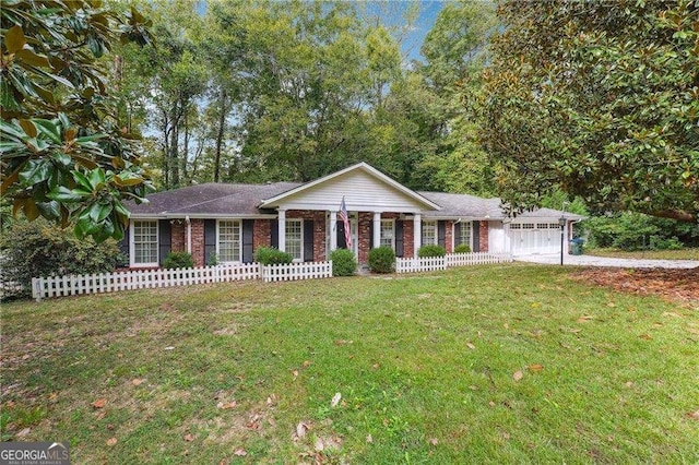 single story home featuring a front yard and a garage